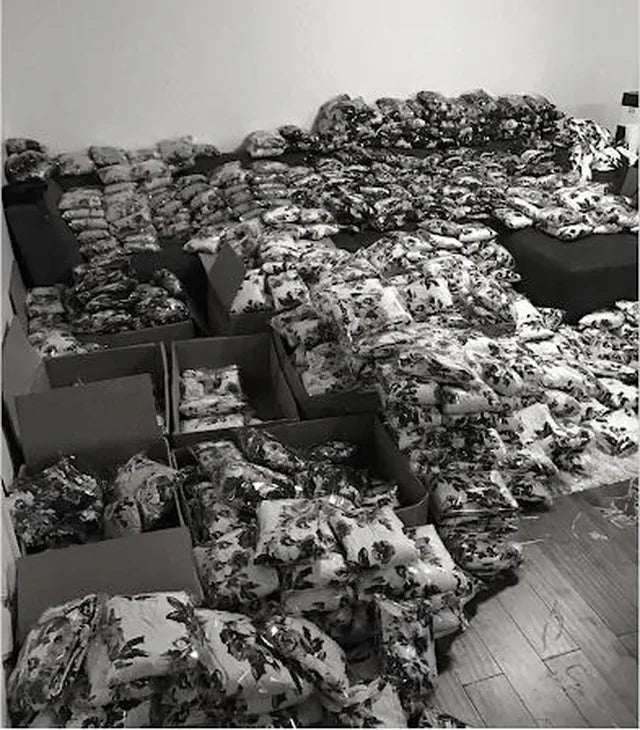 Piles of dresses covering the floor