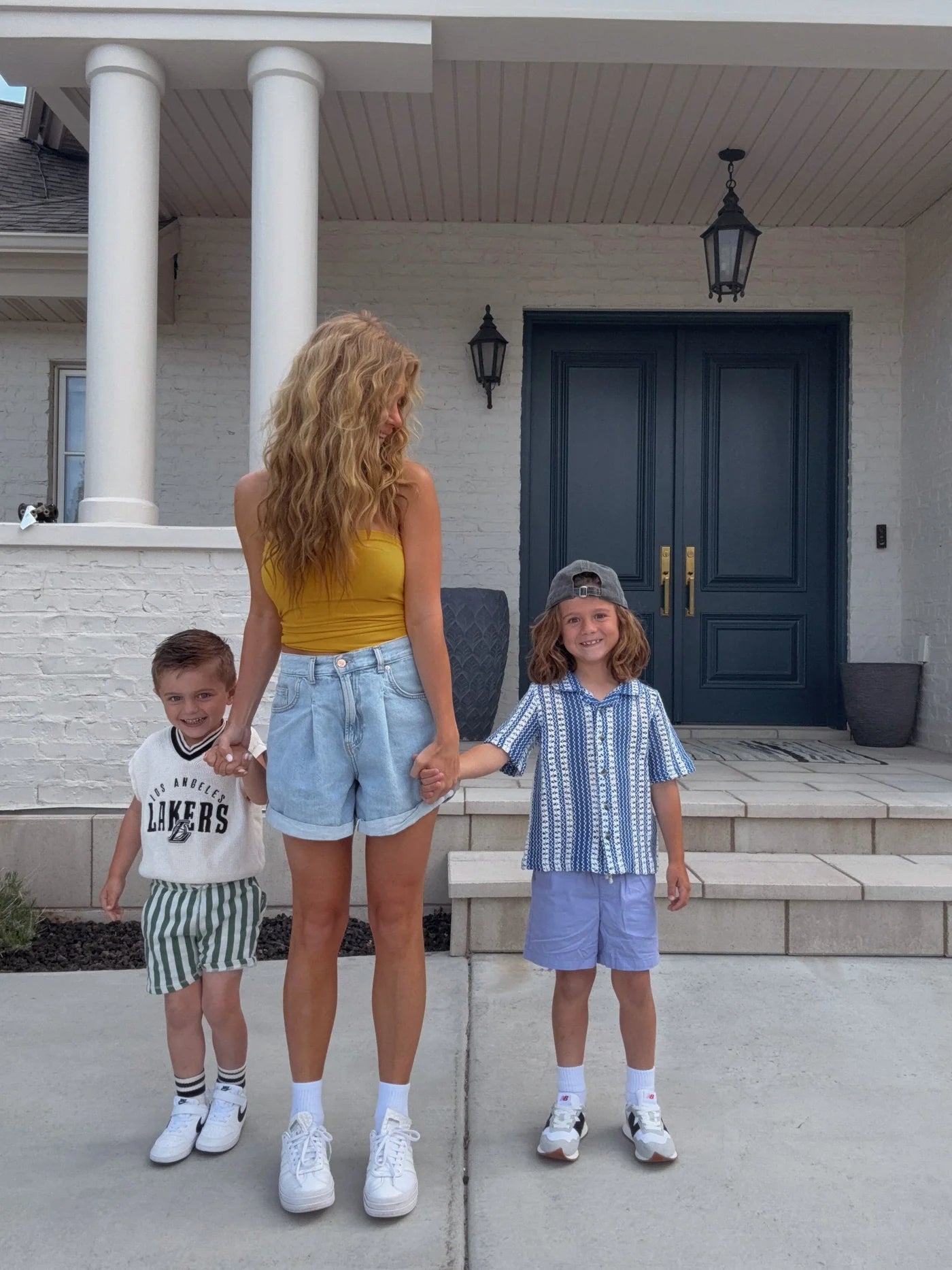 Jessa and her sons on the front steps